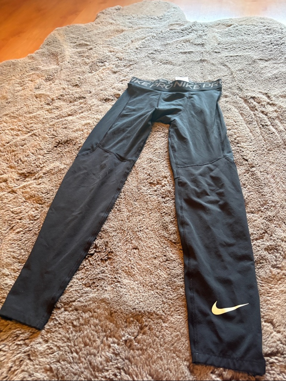 Nike Black Kids' Performance Leggings with Gold Swoosh